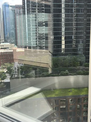 a view of walk in closet with wooden floor
