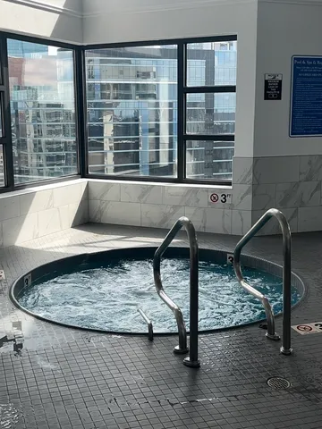 a kitchen with a table chairs and a sink