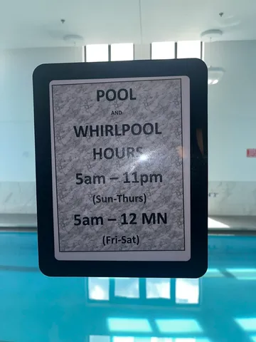 a lobby with furniture and a potted plant