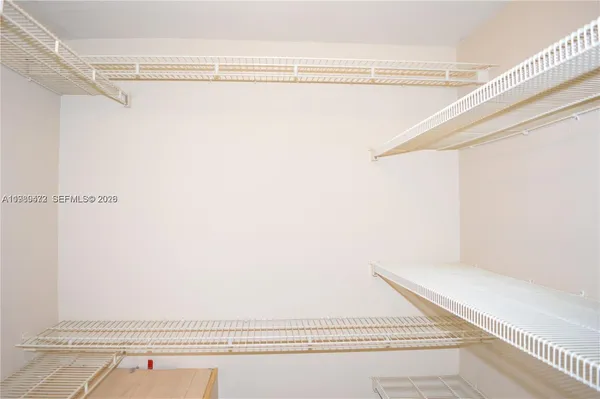 a bathroom with a shower and a view of window