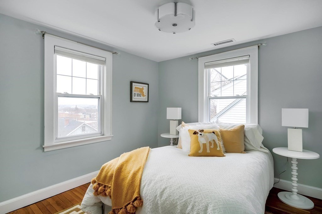 10 Jenness Road Brookline, MA 02446 - Photo 12 of 20 a bedroom with a bed and wooden floor