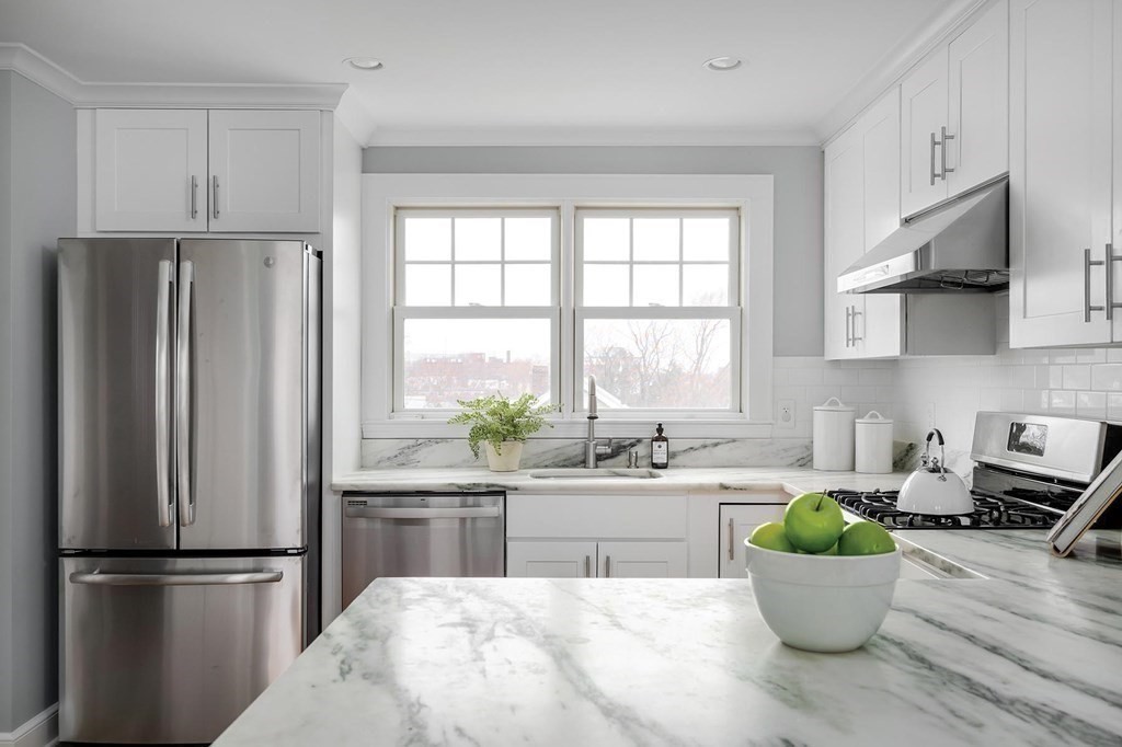10 Jenness Road Brookline, MA 02446 - Photo 6 of 20 a kitchen with a refrigerator and a window