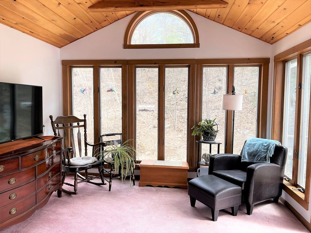 15 Shepard Road Sturbridge, MA 01566 - Photo 14 of 38 a living room with furniture and large windows