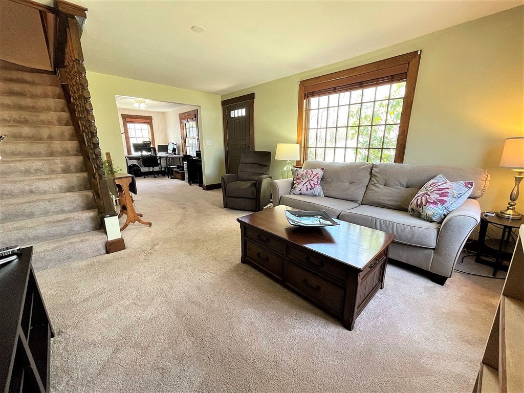15 Shepard Road Sturbridge, MA 01566 - Photo 18 of 38 a living room with furniture and a fireplace