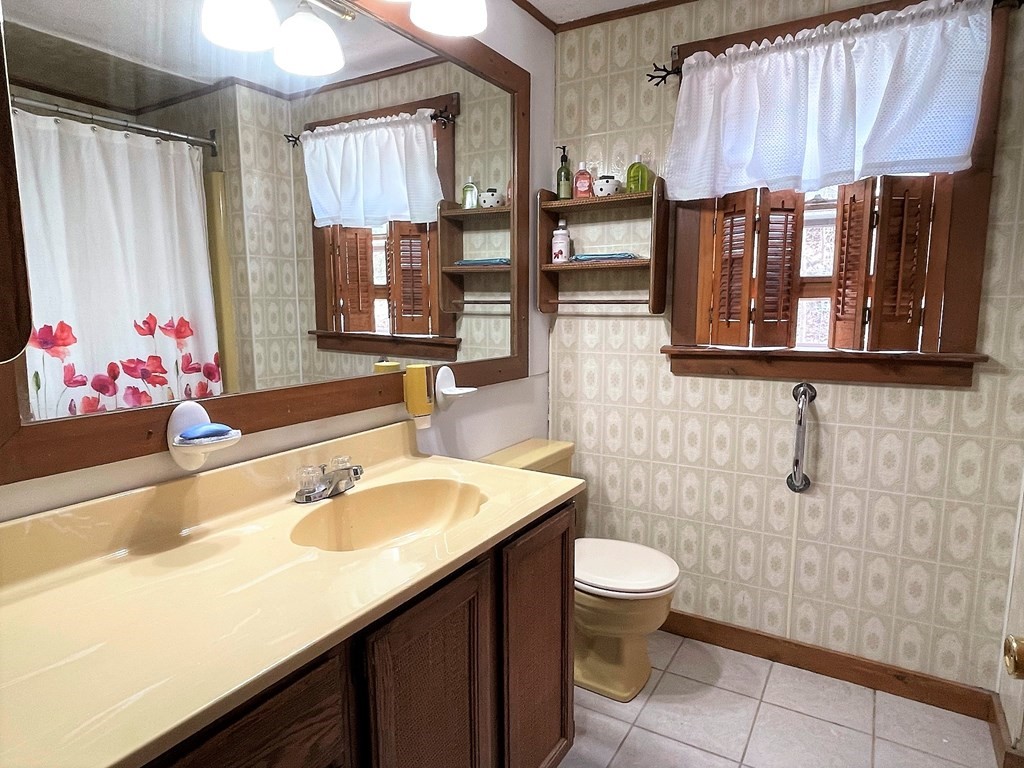 15 Shepard Road Sturbridge, MA 01566 - Photo 10 of 38 a bathroom with a sink a toilet and mirror
