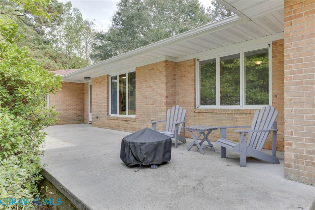 6822 Enfield Road Gloucester, VA 23061 - Photo 4 of 35 View of patio featuring area for grilling