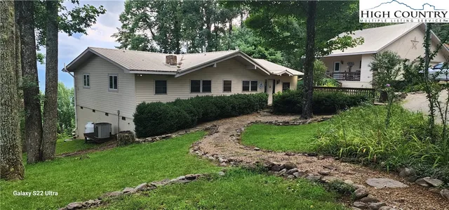 a house view with a garden space