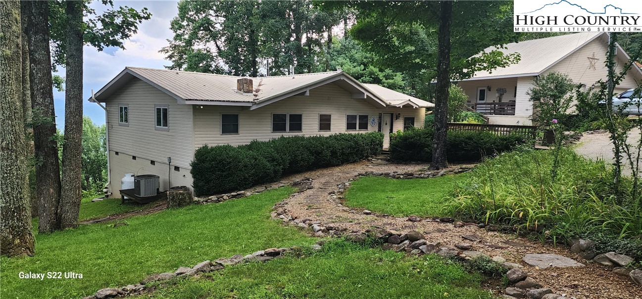 a house view with a garden space
