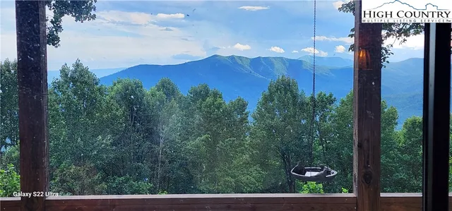 a view of a house with a yard and garage