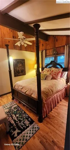 a bedroom with furniture and a window