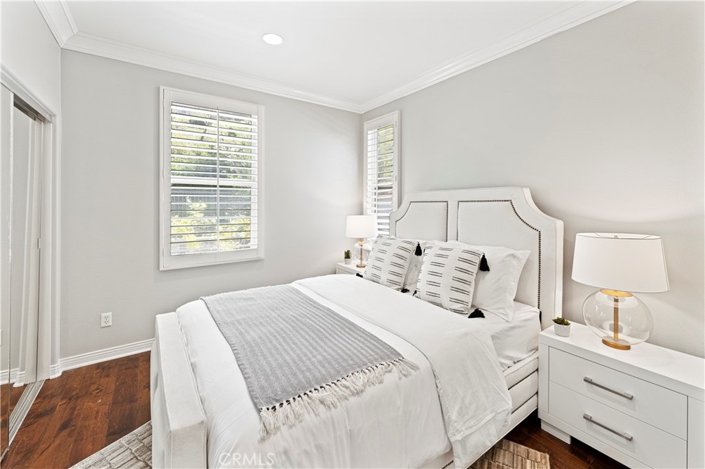 54 Valley Terrace Irvine, CA 92603 - Photo 30 of 60 a bedroom with a bed and a window