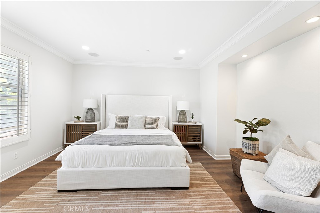 54 Valley Terrace Irvine, CA 92603 - Photo 34 of 60 a bedroom with a bed and wooden floor