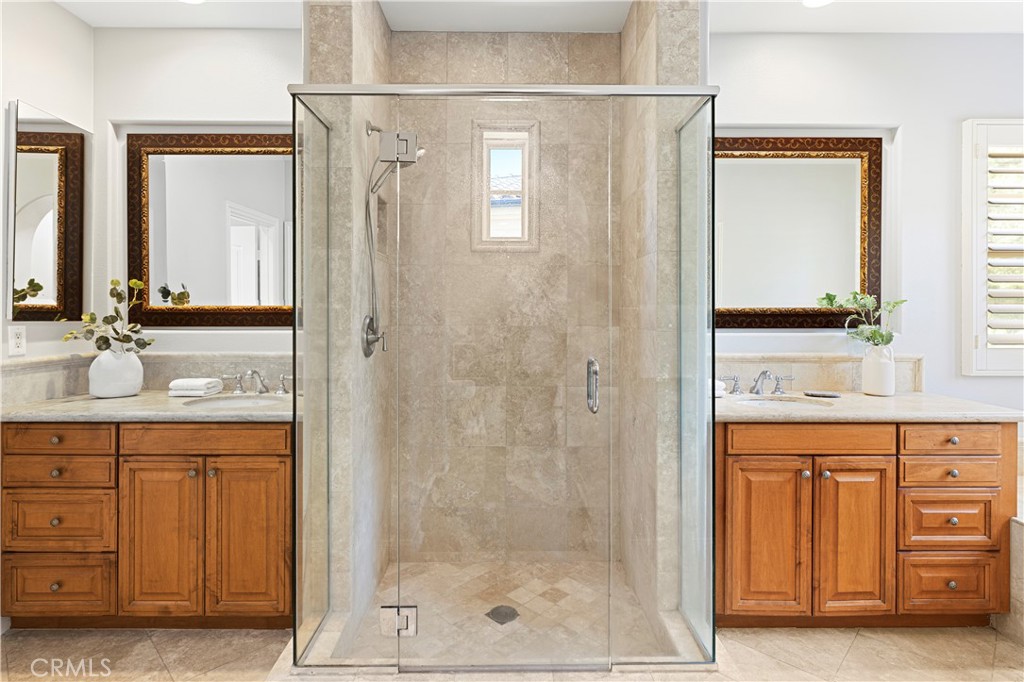54 Valley Terrace Irvine, CA 92603 - Photo 36 of 60 a bathroom with a shower sink and mirror