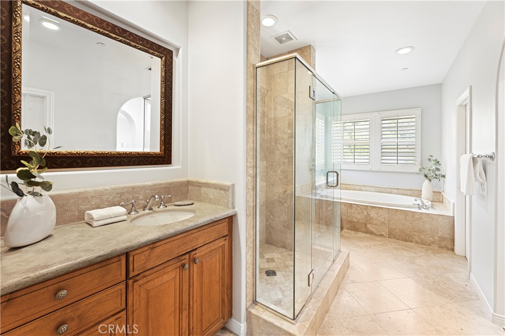 54 Valley Terrace Irvine, CA 92603 - Photo 37 of 60 a spacious bathroom with a tub sink and mirror