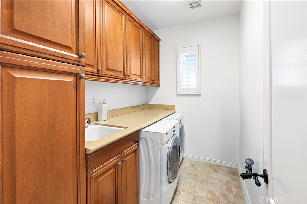 54 Valley Terrace Irvine, CA 92603 - Photo 42 of 60 a utility room with dryer and washer