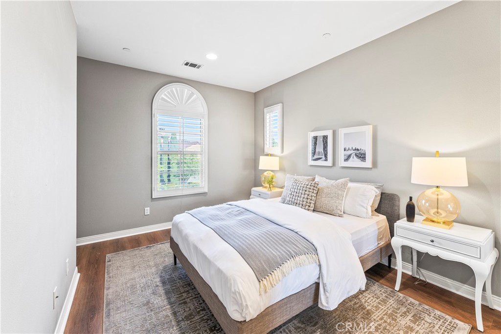 54 Valley Terrace Irvine, CA 92603 - Photo 43 of 60 a bedroom with a white bed and a window