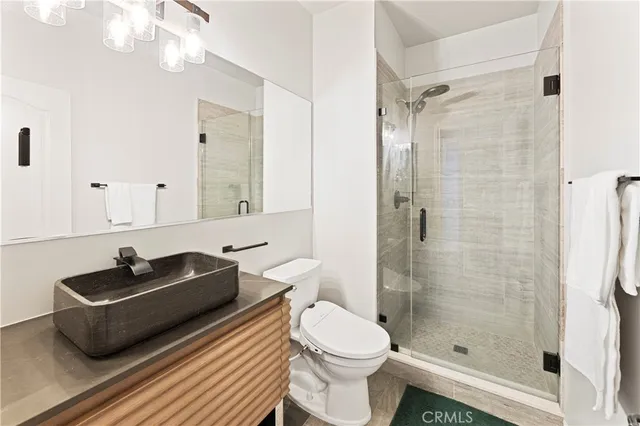 a dining room with furniture and a potted plant