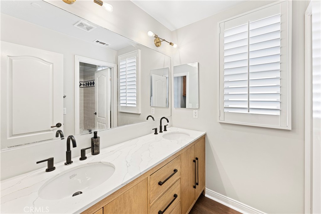 54 Valley Terrace Irvine, CA 92603 - Photo 50 of 60 a bathroom with a sink and a mirror