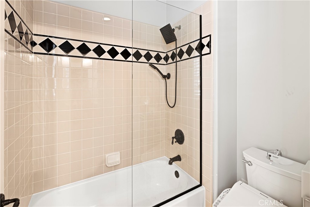 54 Valley Terrace Irvine, CA 92603 - Photo 55 of 60 a bathroom with a shower and a toilet