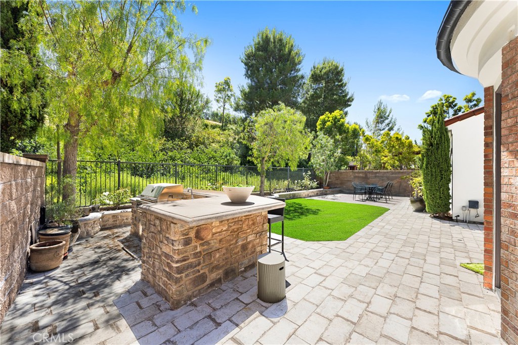 54 Valley Terrace Irvine, CA 92603 - Photo 58 of 60 a view of a backyard with a patio and plants