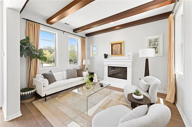 a view of a patio with couple of chairs and a fountain