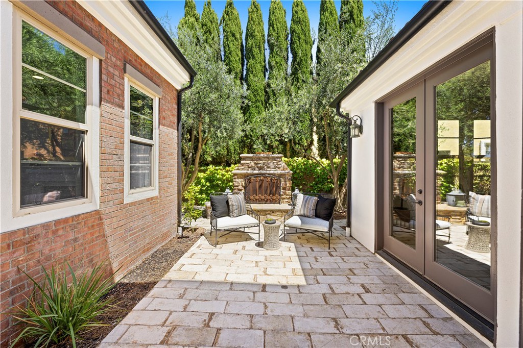 54 Valley Terrace Irvine, CA 92603 - Photo 10 of 60 a view of a patio with table and chairs and potted plants