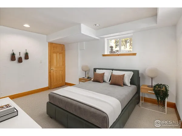 a living room with furniture a window and a potted plant