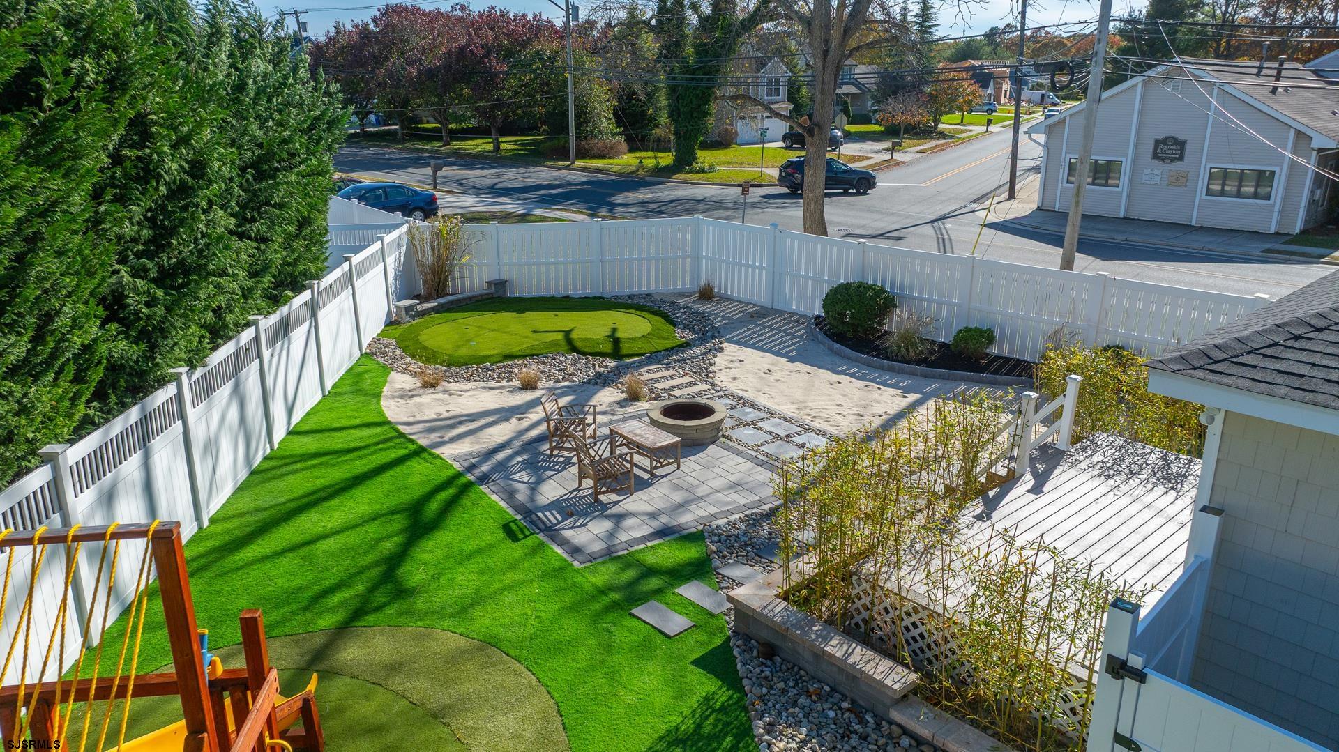 1203 West Mill Road Northfield, NJ 08225 - Photo 68 of 90 a view of a swimming pool with a patio