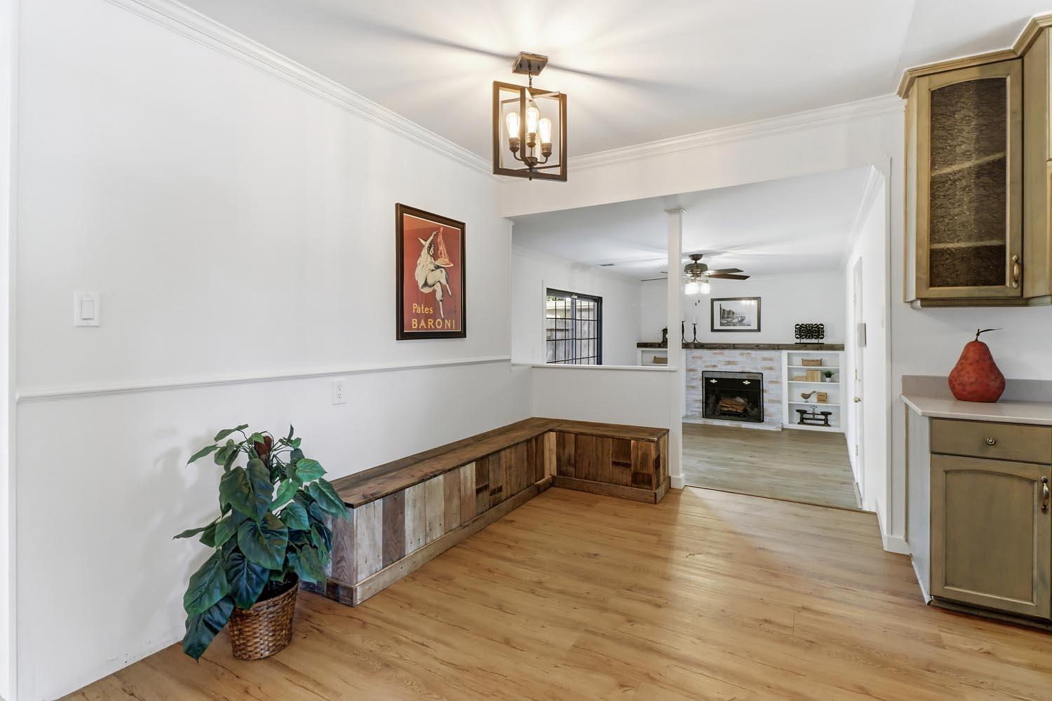 1224 Spruce Lane Davis, CA 95616 - Photo 14 of 49 a hallway with wooden floor and chandelier