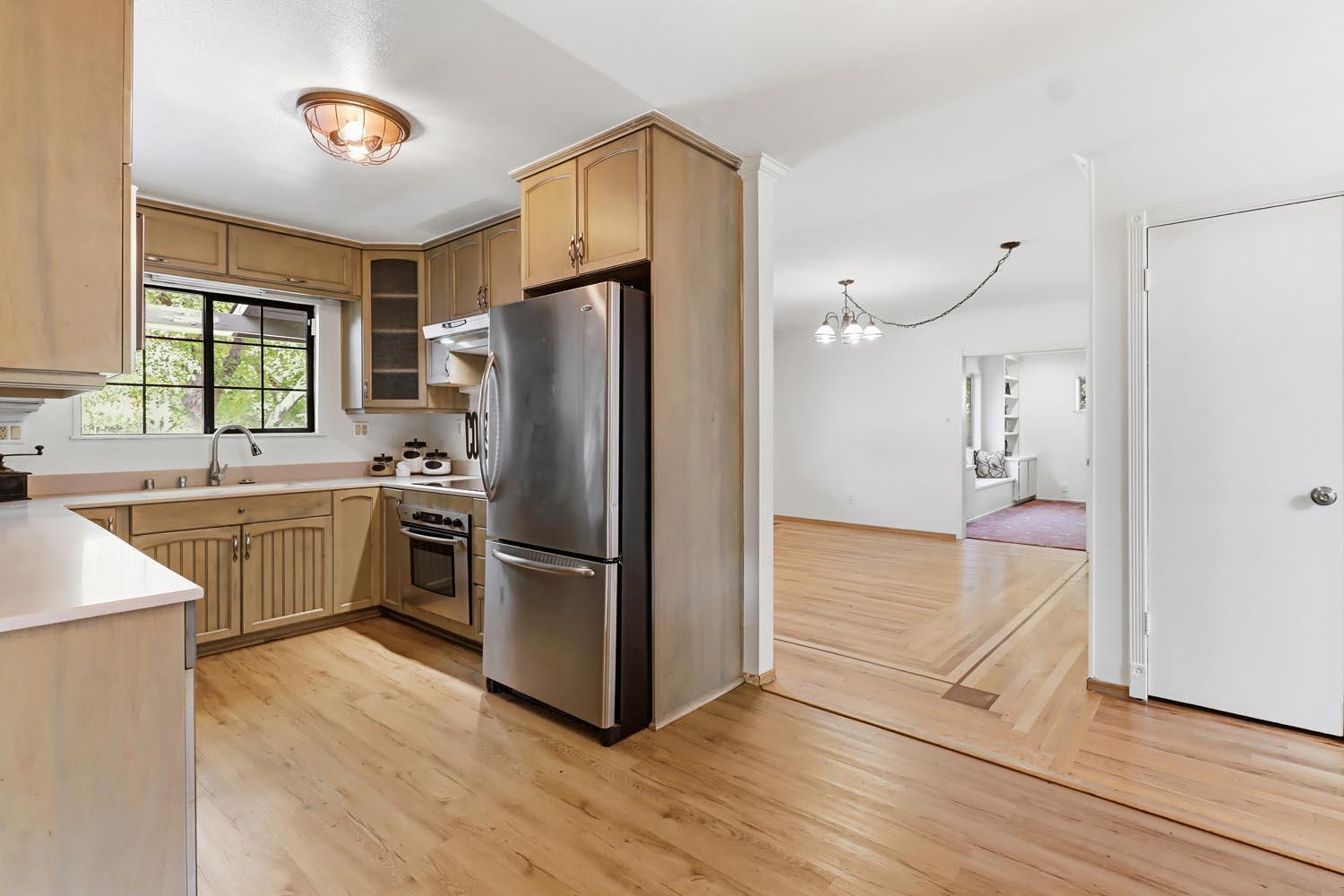 1224 Spruce Lane Davis, CA 95616 - Photo 19 of 49 a kitchen with a refrigerator and a sink