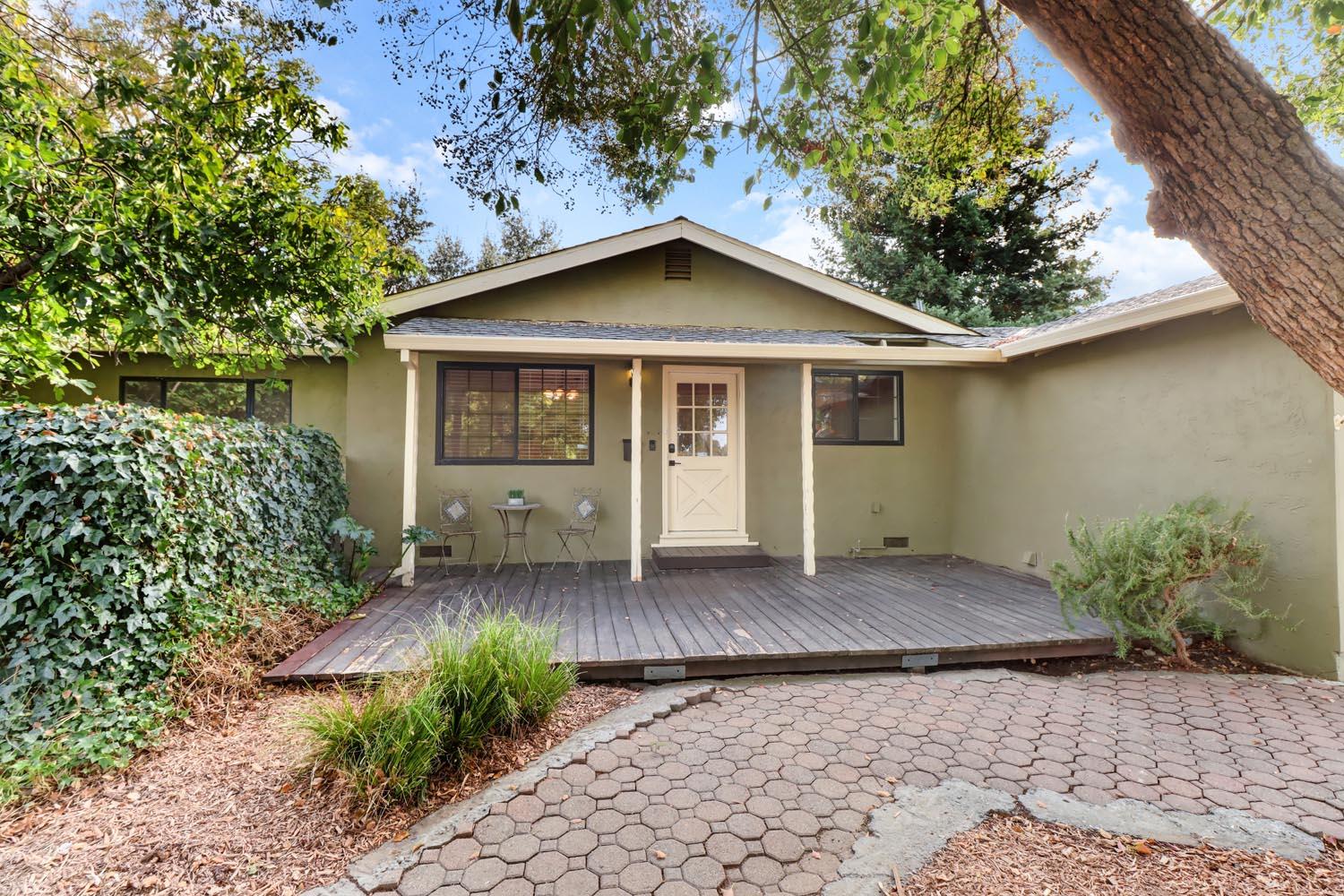 1224 Spruce Lane Davis, CA 95616 - Photo 2 of 49 a backyard of a house with plants and trees