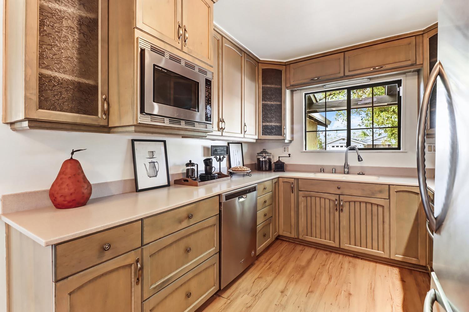1224 Spruce Lane Davis, CA 95616 - Photo 22 of 49 a kitchen with stainless steel appliances granite countertop a sink and a stove