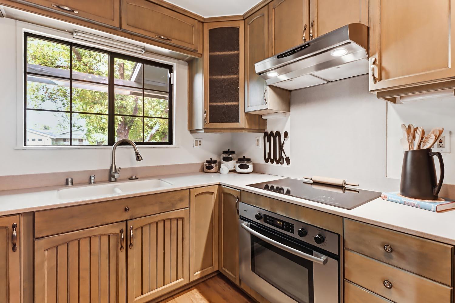 1224 Spruce Lane Davis, CA 95616 - Photo 23 of 49 a kitchen with a sink stove and cabinets