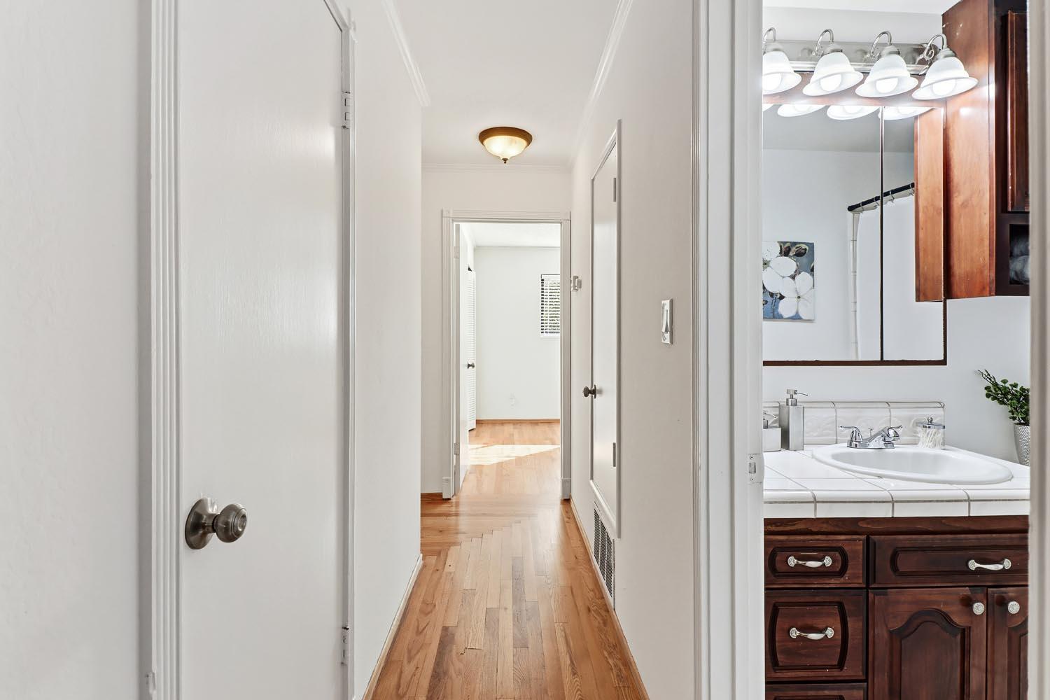1224 Spruce Lane Davis, CA 95616 - Photo 26 of 49 a bathroom with a sink vanity and a mirror