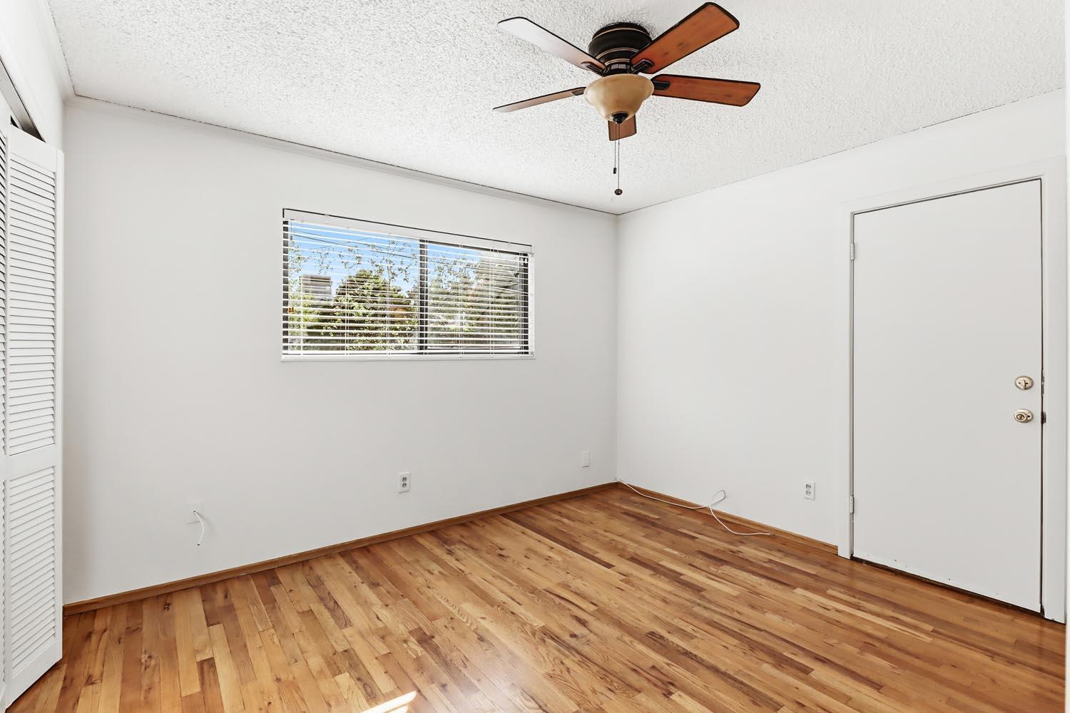 1224 Spruce Lane Davis, CA 95616 - Photo 27 of 49 an empty room with a window and a ceiling fan