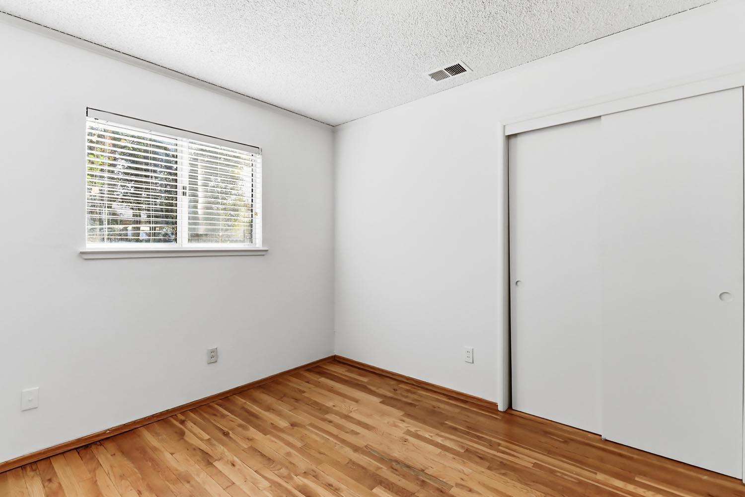 1224 Spruce Lane Davis, CA 95616 - Photo 33 of 49 a view of empty room with wooden floor and fan