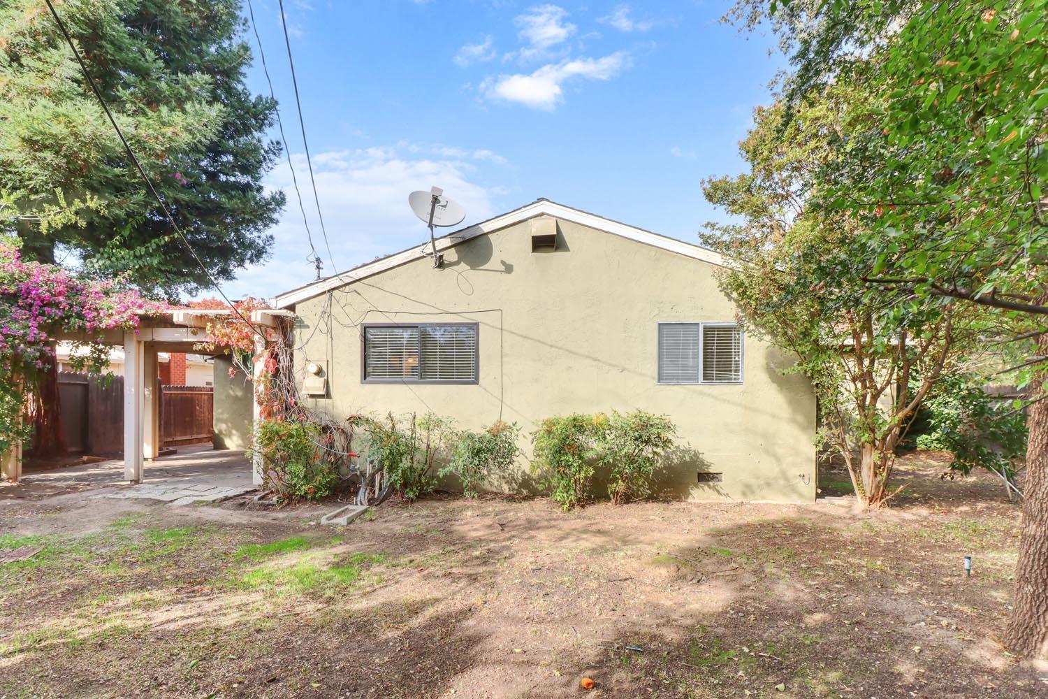 1224 Spruce Lane Davis, CA 95616 - Photo 40 of 49 a view of a house with a yard and tree