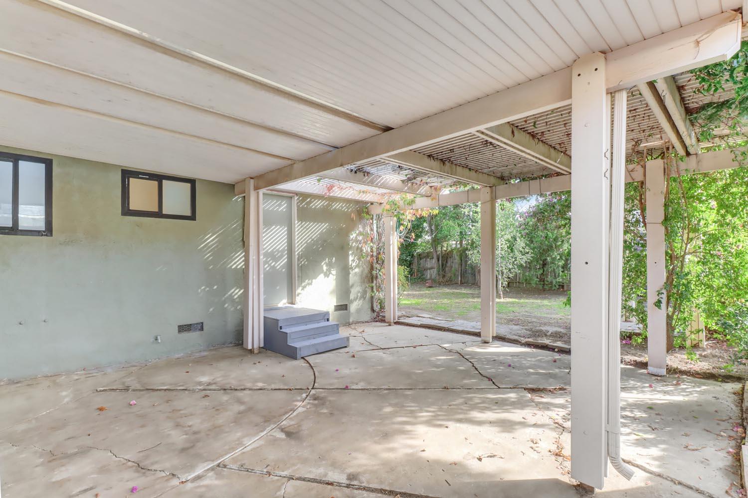 1224 Spruce Lane Davis, CA 95616 - Photo 44 of 49 a backyard of a house with basket ball court and floor to ceiling window