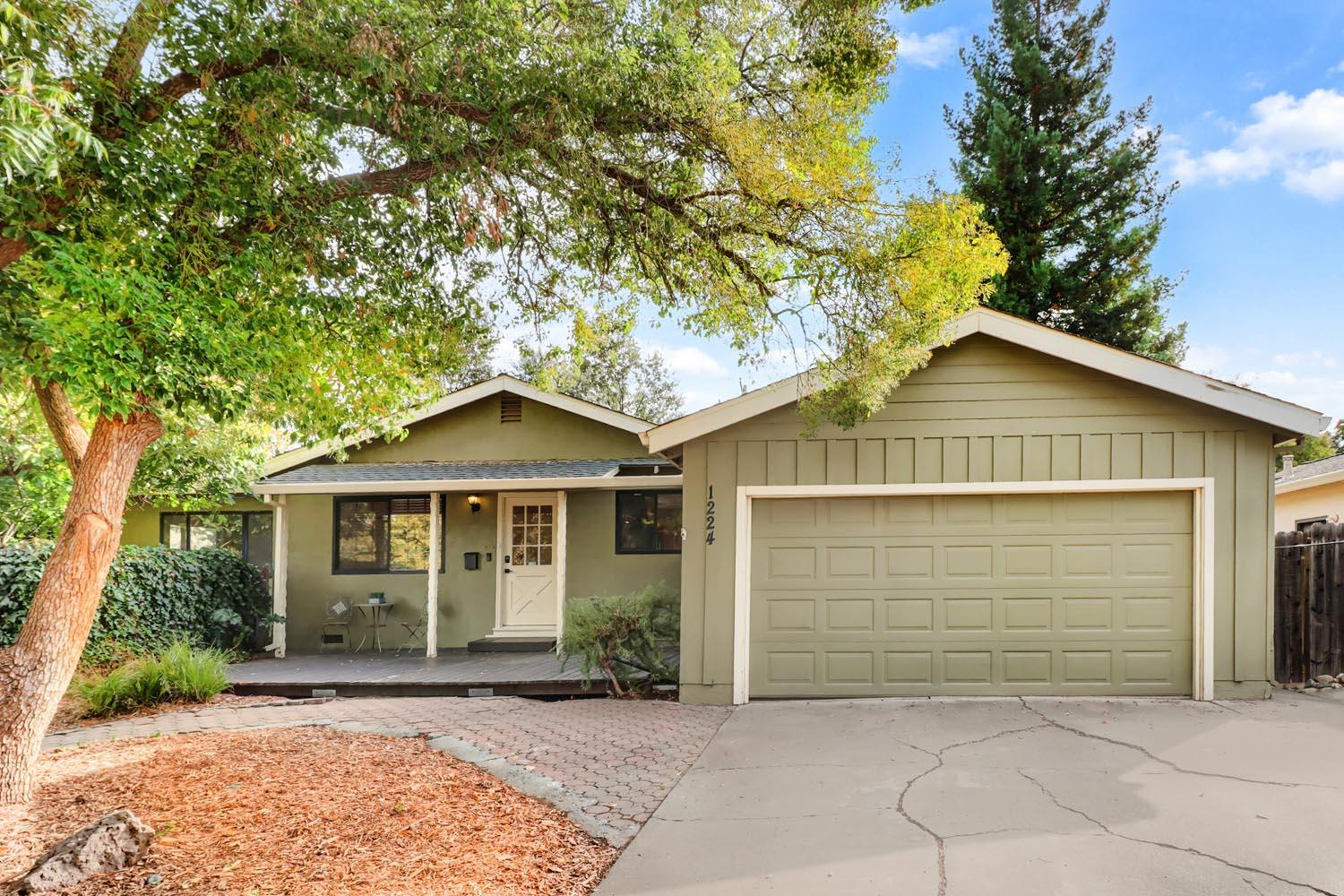 1224 Spruce Lane Davis, CA 95616 - Photo 46 of 49 a front view of a house with a garden
