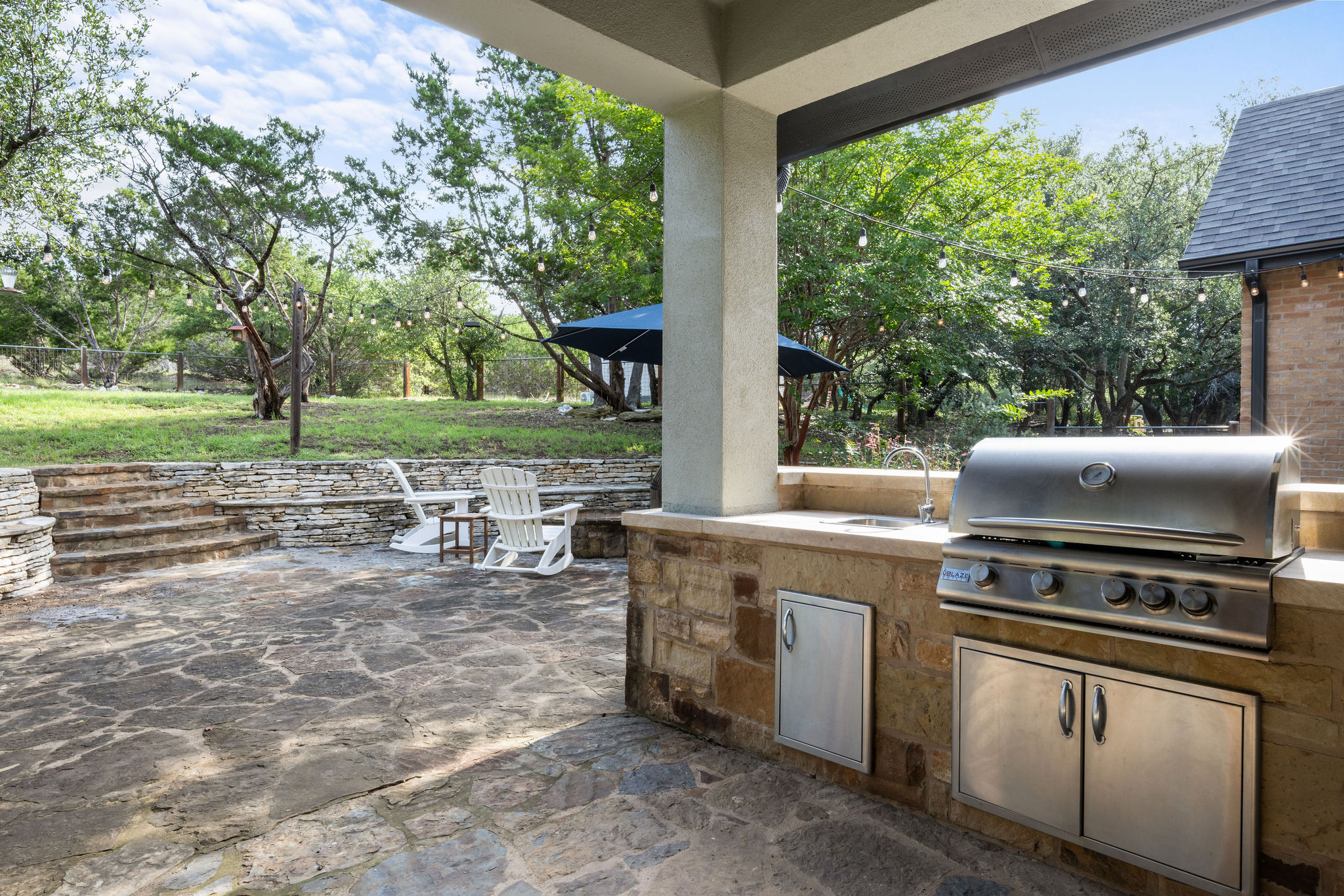 279 Rugged Earth Drive Austin, TX 78737 - Photo 38 of 40 a view of a kitchen with a stove and a large window