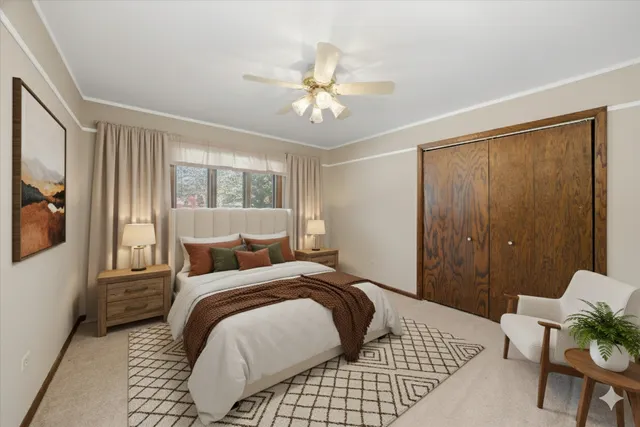 a bedroom with a bed and glass walk in closet