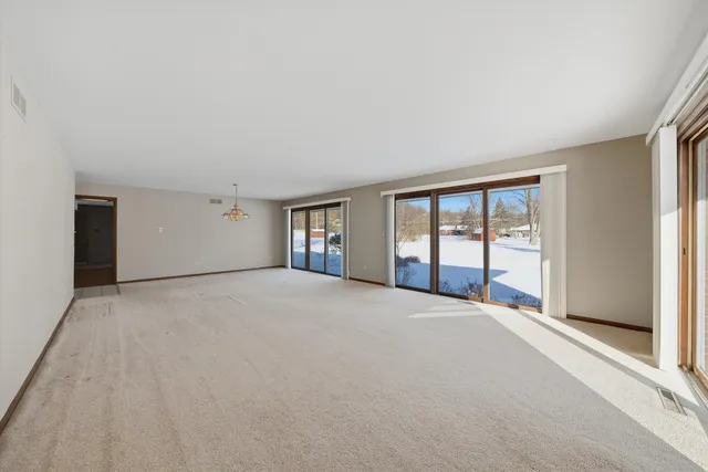 a big room with windows and closet