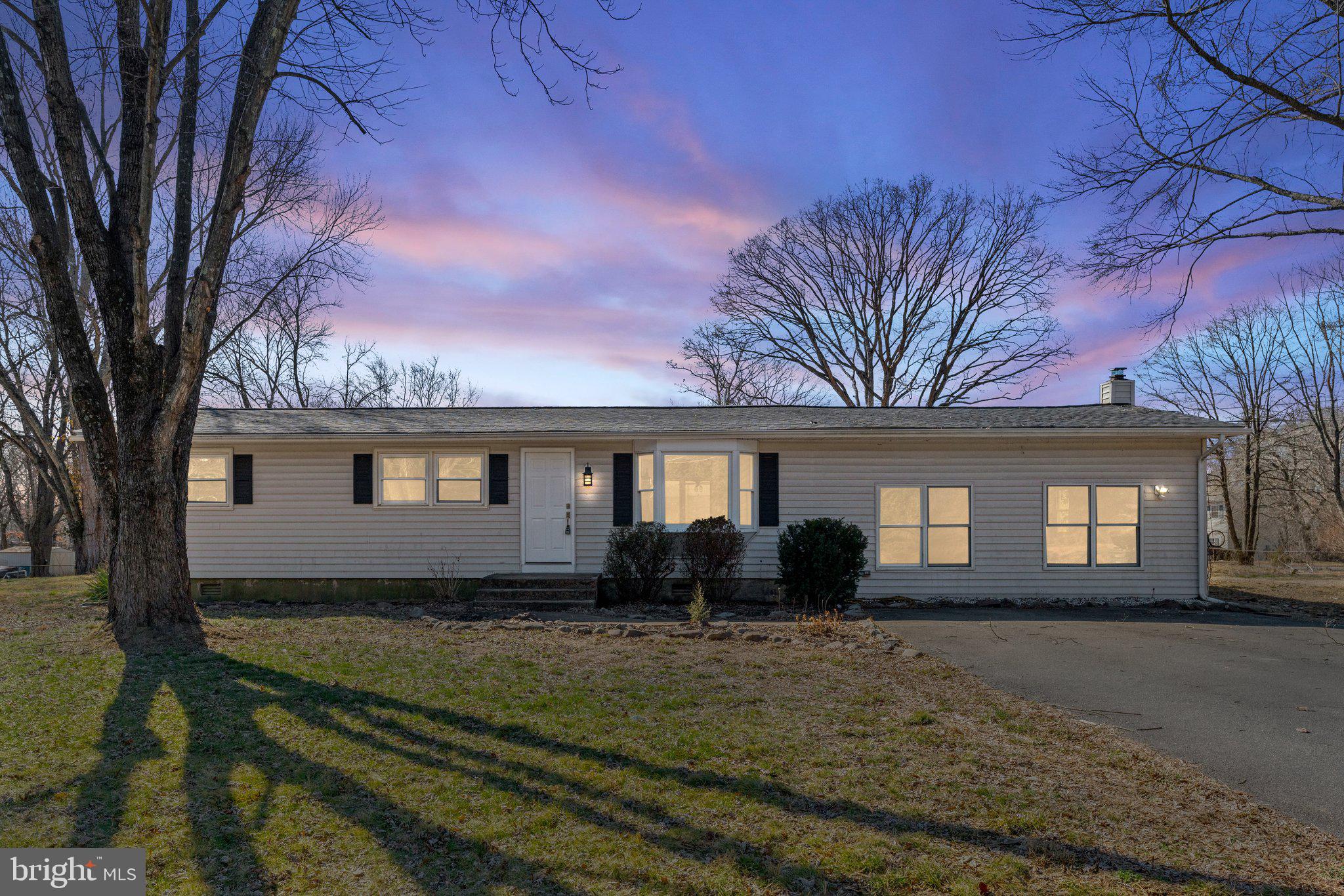 15307 Thoroughfare Road Gainesville, VA 20155 - Photo 1 of 38 a front view of a house with yard