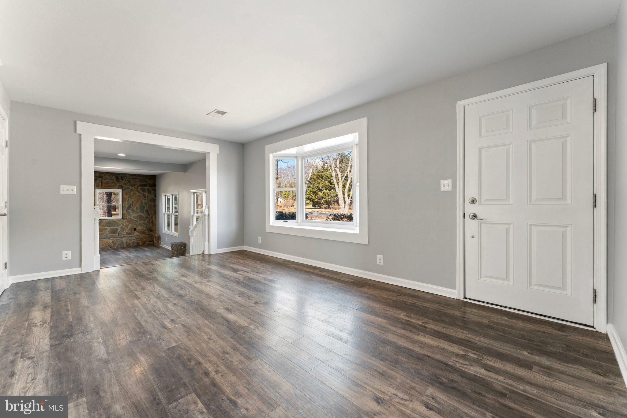 15307 Thoroughfare Road Gainesville, VA 20155 - Photo 17 of 38 a view of an empty room with window and wooden floor
