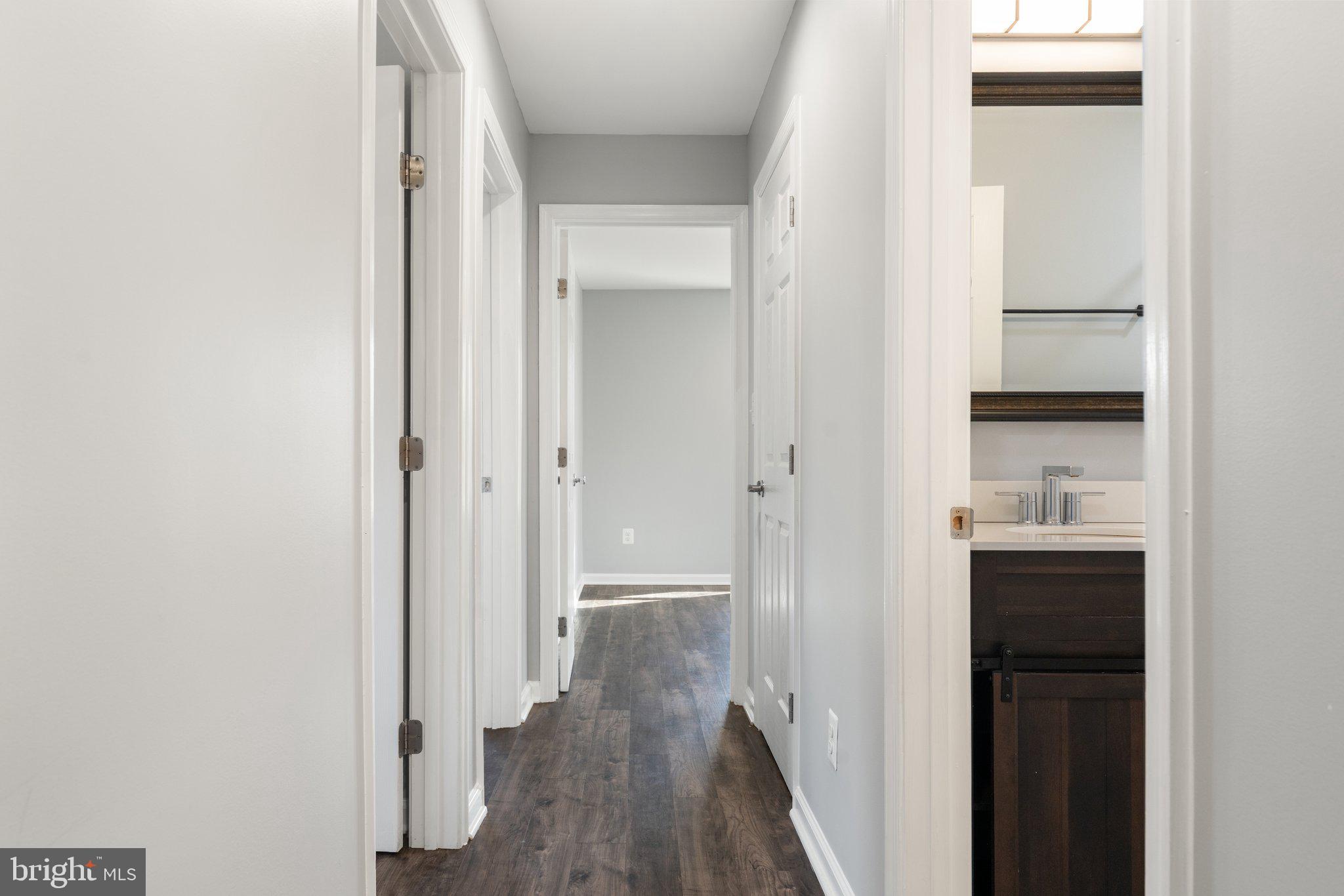 15307 Thoroughfare Road Gainesville, VA 20155 - Photo 18 of 38 a view of a hallway with wooden floor