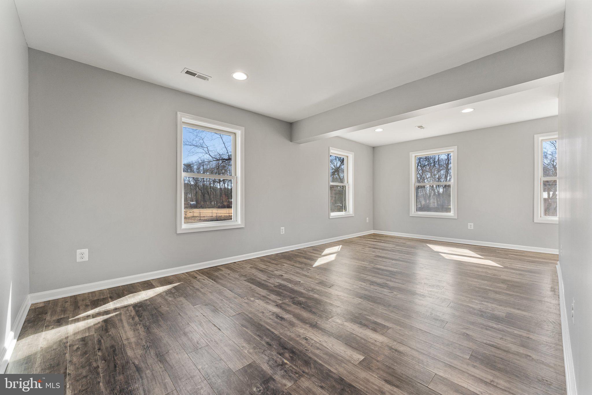 15307 Thoroughfare Road Gainesville, VA 20155 - Photo 19 of 38 a view of empty room with wooden floor and fan