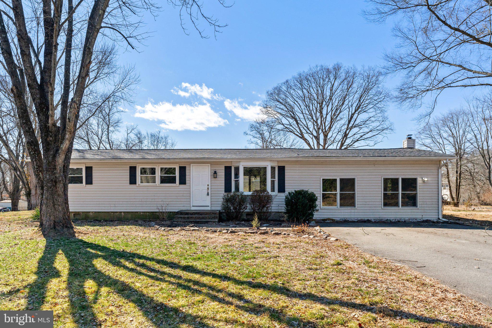 15307 Thoroughfare Road Gainesville, VA 20155 - Photo 2 of 38 a house that has a tree in front of it