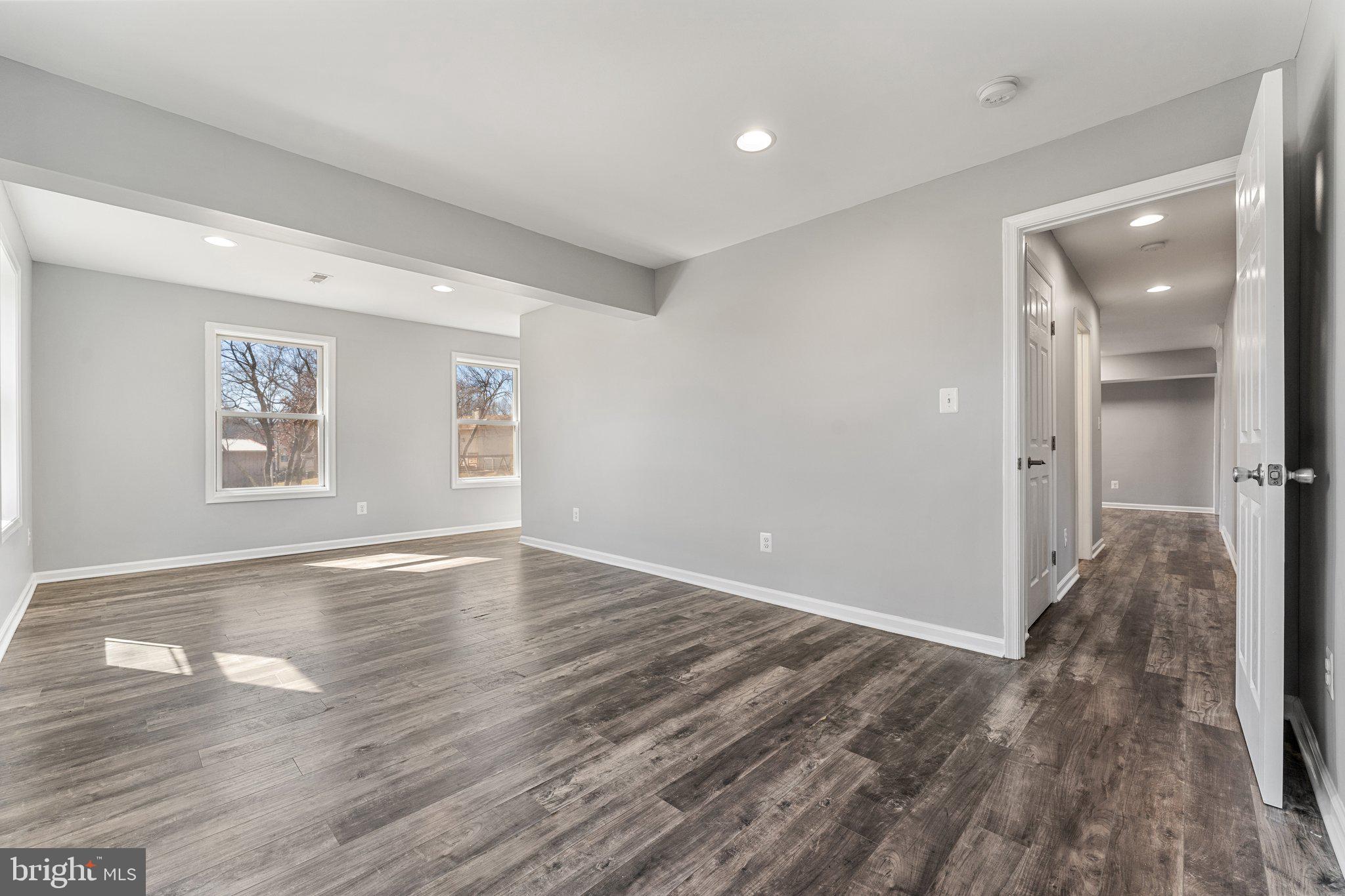 15307 Thoroughfare Road Gainesville, VA 20155 - Photo 25 of 38 wooden floor in an empty room with a window