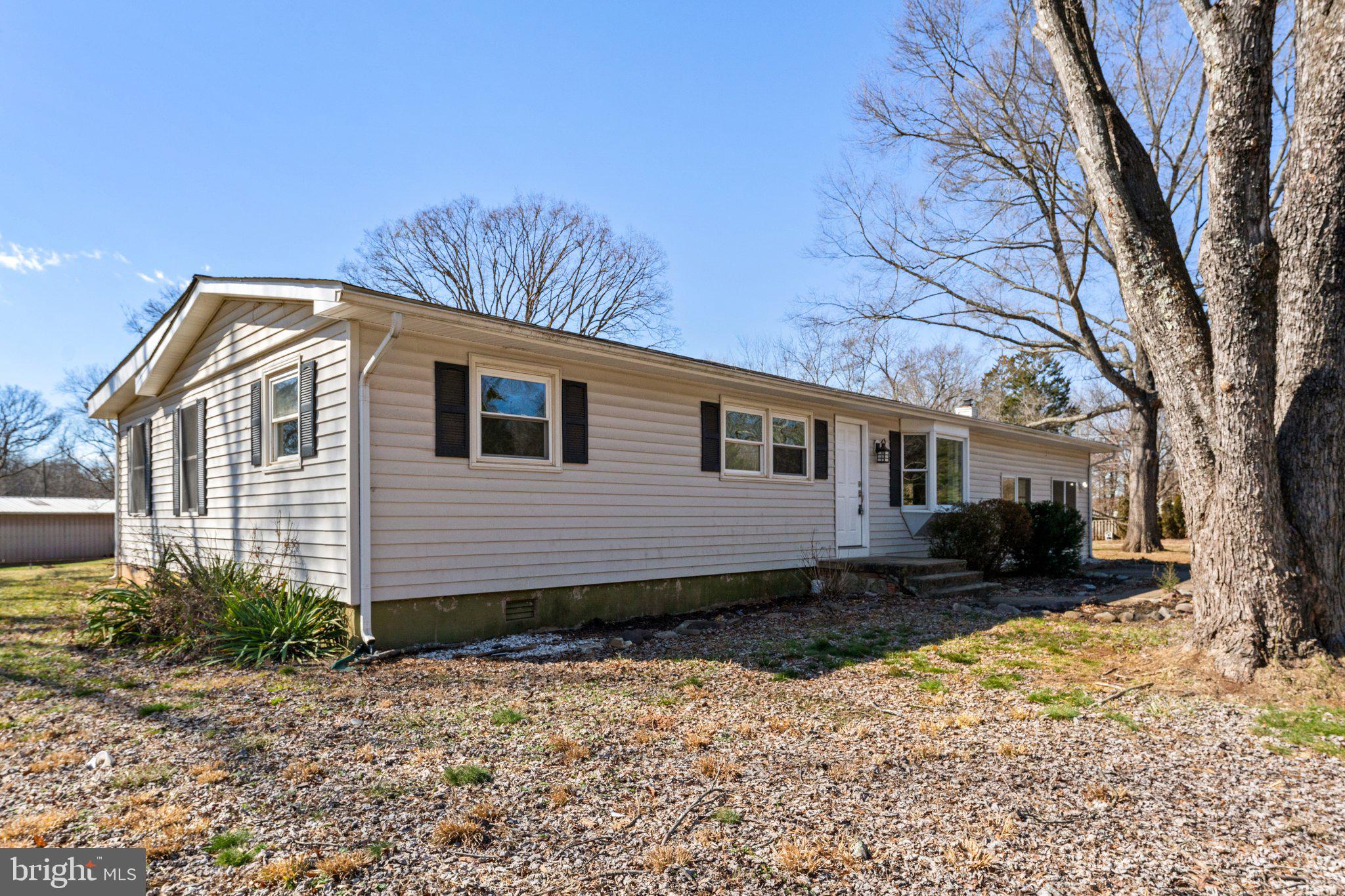 15307 Thoroughfare Road Gainesville, VA 20155 - Photo 4 of 38 a front view of a house with a yard