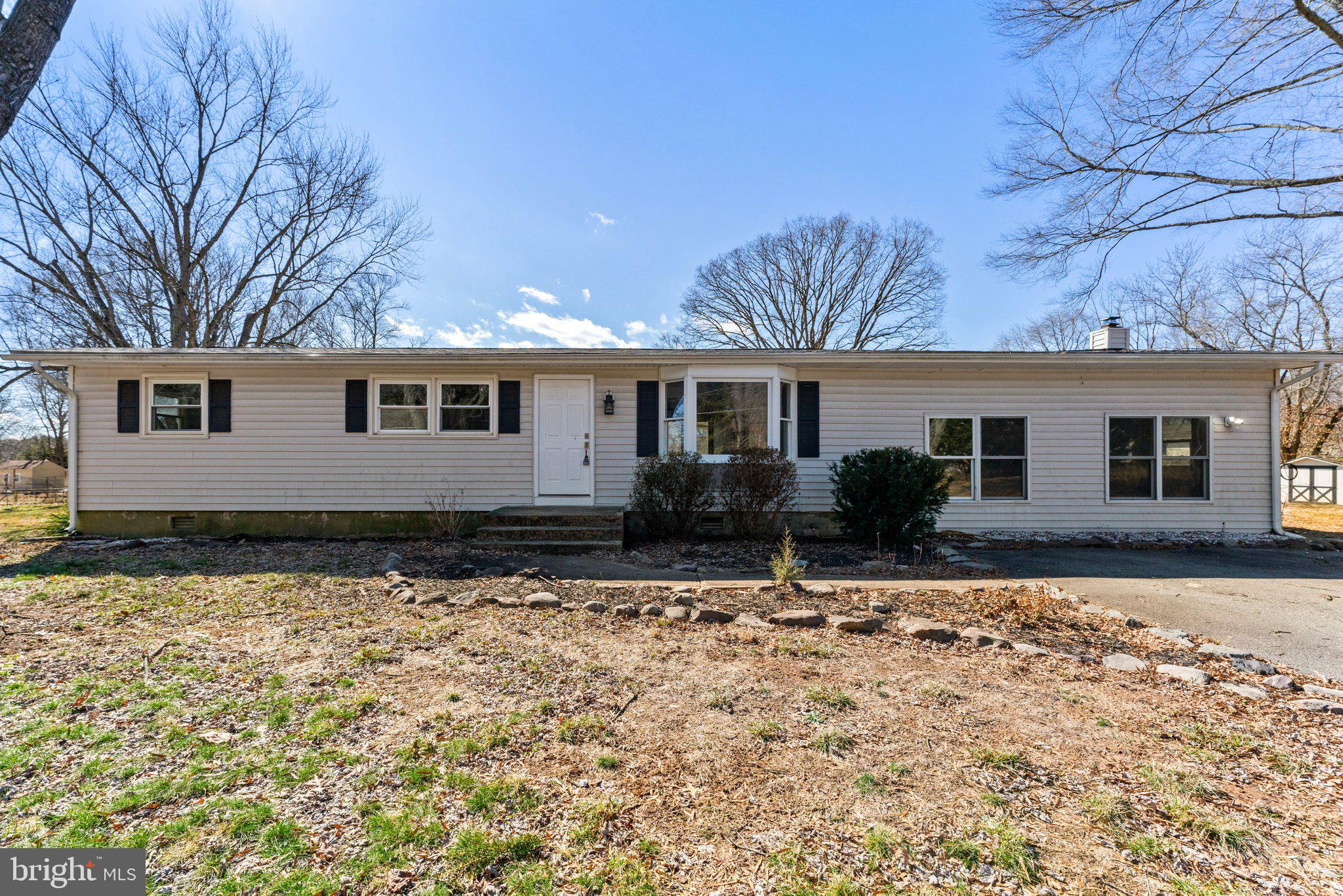 15307 Thoroughfare Road Gainesville, VA 20155 - Photo 5 of 38 a front view of a house with a yard